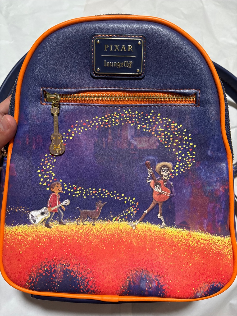 Loungefly Coco Illustration Mini Backpack in Purple and Orange